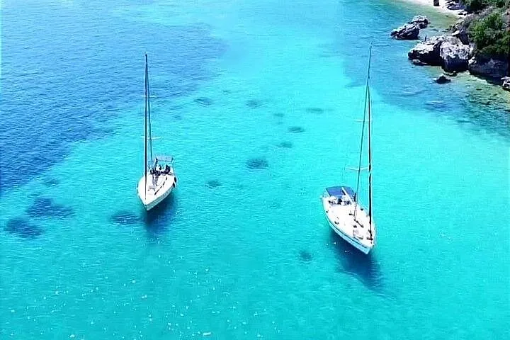 Private sailing yacht anchored off Vido island near Corfu Town on a private Corfu boat tour