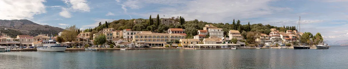 Kassiopi harbour on the north coast of Corfu seen on a private yacht Corfu boat tour