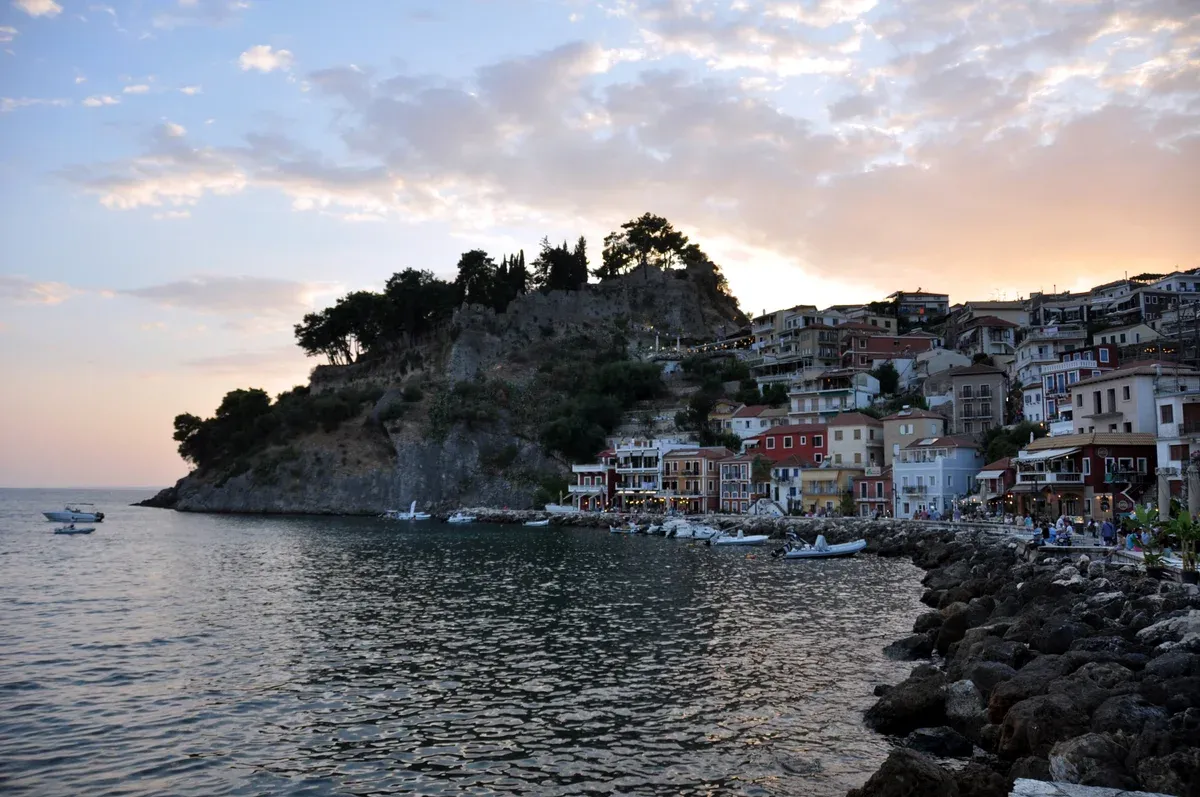Parga harbour and the Venetian castle at evening on a Corfu boat tour to Parga and Sivota